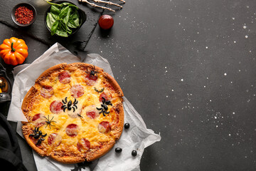 Tasty pizza for Halloween celebration on black background