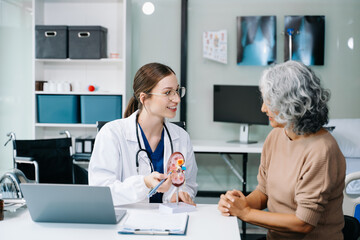 Portrait of female doctor explaining diagnosis to her patient. Doctor Meeting With Patient In Exam Room. A medical practitioner reassuring a patient in hospital