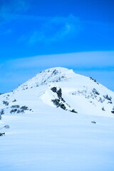 Snow-Covered Mountain Peak in Winter