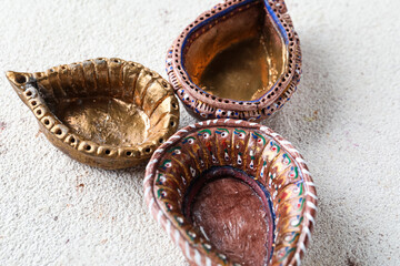 Fototapeta premium Diya lamps for celebration of Divaly on grunge white background