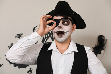 Young man dressed as pirate at Halloween party, closeup