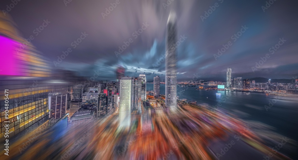 Poster a motion blurred image of the hong kong skyline at night with tall skyscrapers and a view of the har