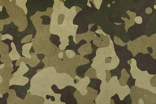 Texture of fabric with military camouflage. Military theme background.