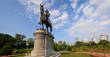 Fototapeta premium : Boston skyline with the equestrian statue of George Washington on the foreground in the Public Garden, USA
