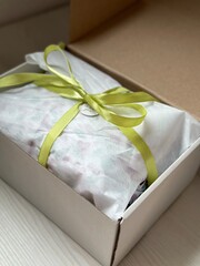 white gift box with ribbon