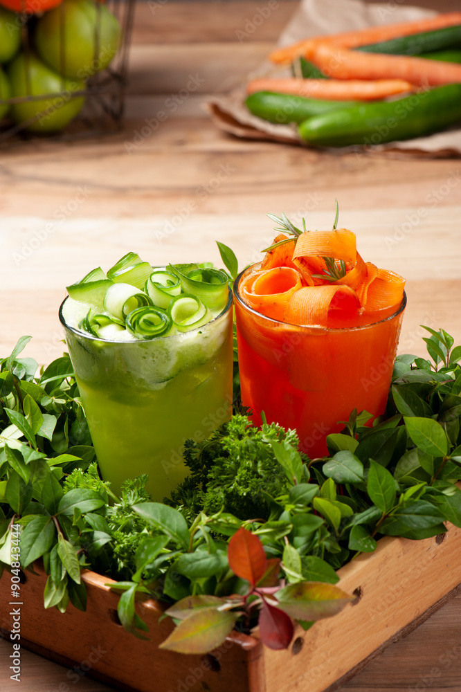 Wall mural beautifully decorated freshly prepared carrot and cucumber juice glasses on a tray filled with vario