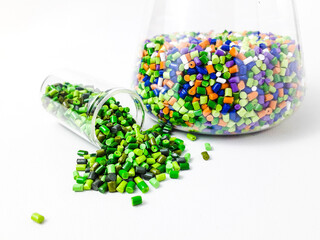 Various colors of mixed masterbatch granules, isolated on white background.Color pigment carrier...