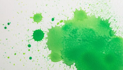 Green paint splash art on a white drawing paper background