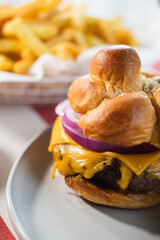 cheeseburger closeup on a knotted roll
