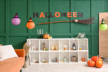 Interior of living room decorated for Halloween with shelf unit
