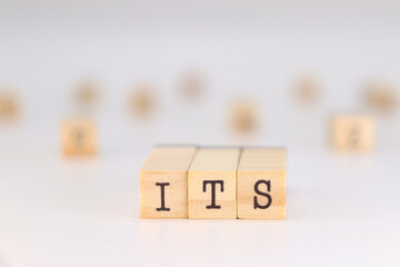 ITS Acronym - Sexually Transmitted Infection written in Spanish on wooden cubes isolated on white background with space for text.