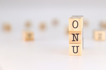ONU word written on wooden cubes isolated on white background with copy space for text.