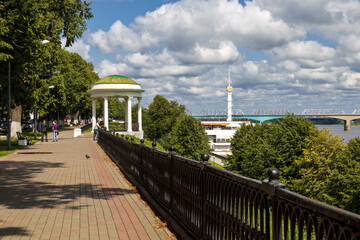 Volzhskaya embankment with a rotunda gazebo, a view of the Volga river with a river station and a...
