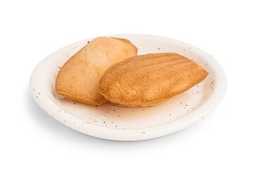 Saucer with tasty Madeleine cookies on white background