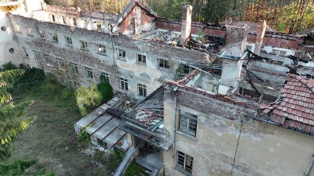 Ruined house. Ruined school building. Abandoned school in the forest