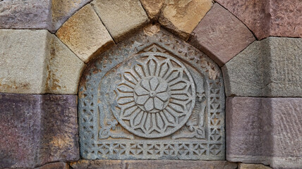 Carving details on the stone of the Tomb of Subhan, Fatehgarh Sahib, Punjab, India.