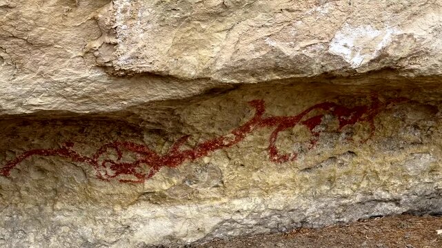 Maori drawing of a taniwha at the rock art drawings in Duntroon in the South Island of New Zealand