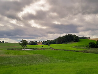 Obraz premium Storm is coming. Cloudy sky over Kashubian meadows.