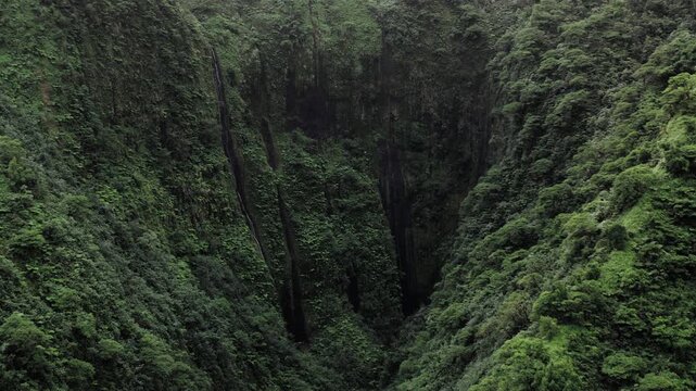 Teahupoo, Tahiti aerial drone view of the river in the valley of mountain Orohena Aorai Ronui. French Polynesia 2024 Paris Olympics surfing spot. Paradise in Pacific Ocean. Moana Disney inspiration