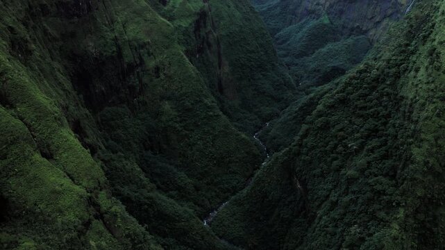 Teahupoo, Tahiti aerial drone view of the river in the valley of mountain Orohena Aorai Ronui. French Polynesia 2024 Paris Olympics surf. Paradise Pacific Ocean. Moana Disney inspiration for Te Fiti.