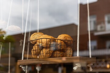 Freshly Baked Croissants Displayed in a Bakery Window