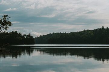Lake landscape view on calm hazy summer day in Ontario, Canada.
