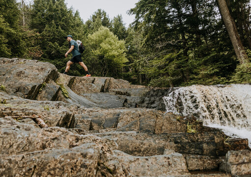 male hikers walks along Appalachian trail at Wilson Falls, Maine