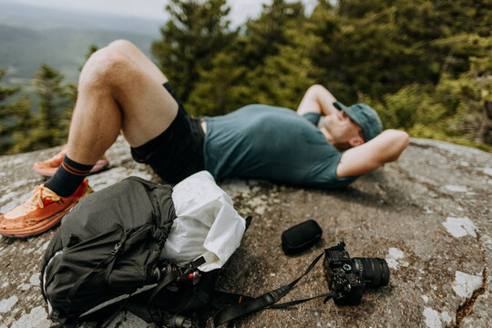 hiker with backpack and camera takes a nap. Appalachian Trail.