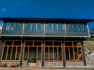 cafe or restaurant with an unfinished industrial style located with views of hills and forests 