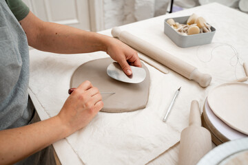 Wedging the clay to eliminate air bubbles. Creating perfect homogenous consistence for ceramics...