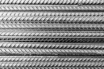 bars of steel reinforcement in close-up black white photo