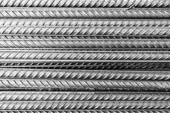 bars of steel reinforcement in close-up black white photo