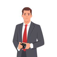 Naklejka premium Young photographer man holding camera wearing business suit.