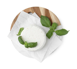 Fresh ricotta (cream cheese) and basil isolated on white, top view
