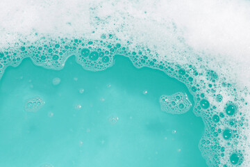 Detergent foam bubble on water. Blue background, Soap sud
