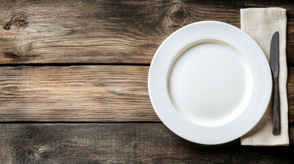 A clean white plate on a rustic wooden table, leaving ample copy space for text.