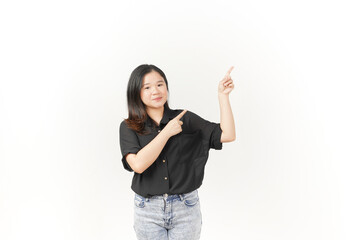 Young Asian woman presenting and pointing side copyspace wearing Black t-shirt and jeans isolated on white background