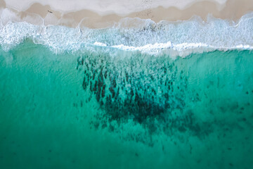 Top down view of waves breaking on North Cottesloe Beach in Perth, Western Australia