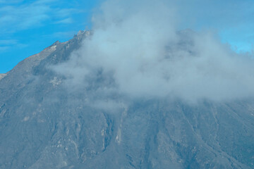 An active volcano peak known as Mount Sinabung at Berastagi in North Sumatra, Indonesia.