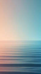 Obraz premium Pastel colors of calm radiant sea waves at sunset.