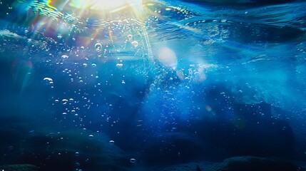 The sun is shining through the water with bubbles