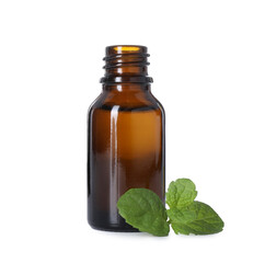 Bottle of essential oil and mint isolated on white