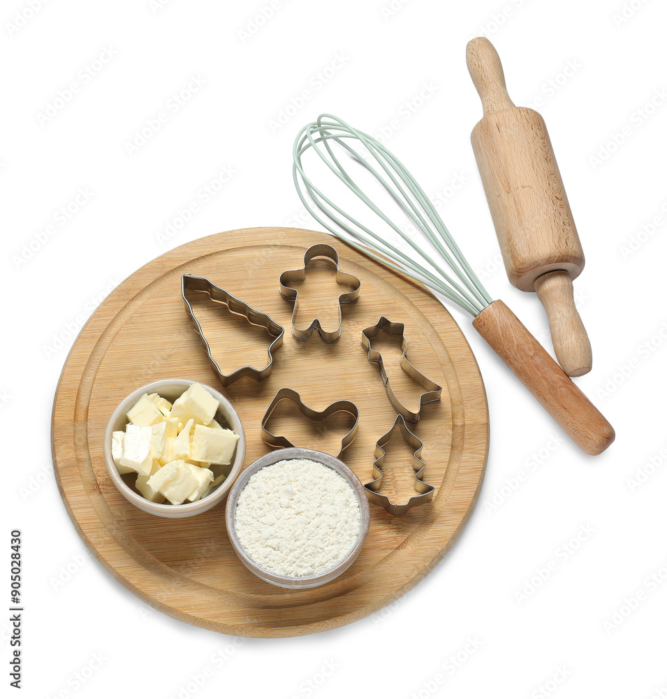 Wall mural flour, butter, cookie cutters, whisk and rolling pin isolated on white, above view