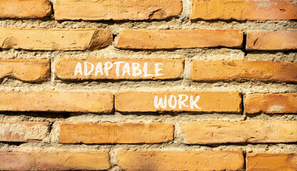 Adaptable work symbol. Concept words Adaptable work on beautiful brick wall. Beautiful red brown brick wall background. Business Adaptable work concept. Copy space.