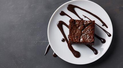 Chocolate Brownie with Powdered Sugar on White Plate