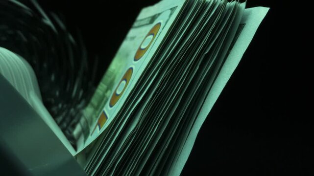 The counting machine counts dollars