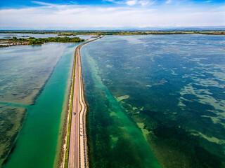 The magic of the Grado lagoon. Among the islands the ancient landing place and the church of San Marco. Beginning of Christian evangelization.