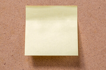 yellow memory note sticked to brown memory board