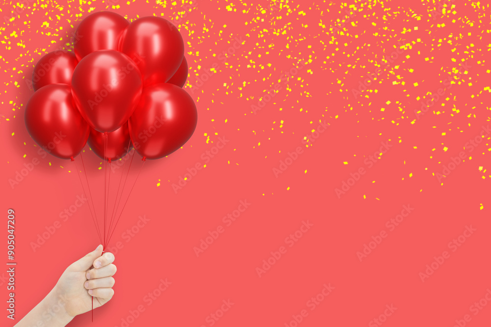 Poster female hand holding bunch of shiny red balloons on red background with yellow confetti. empty space 
