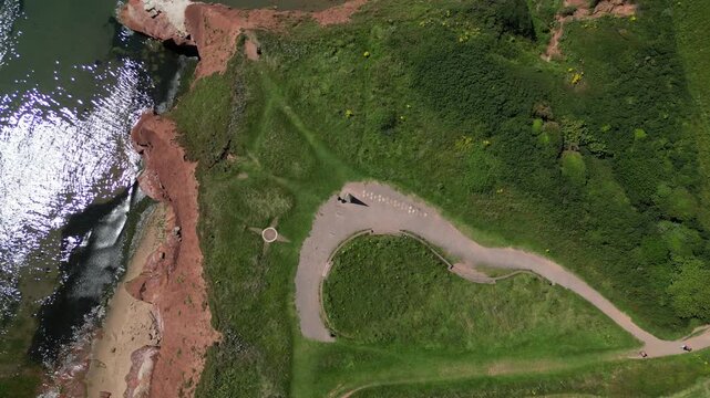 Exmouth, East Devon, England: DRONE VIEWS: The Geoneedle, and sandstone cliffs, which marks the western end of the Jurassic Coast. The Jurassic Coast is a 96 mile long UNESCO World Heritage Site (13).